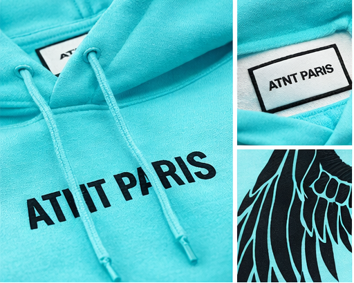 Détail du logo ATNT Paris brodé sur sweat bleu tiffany
finition premium et matière épaisse
