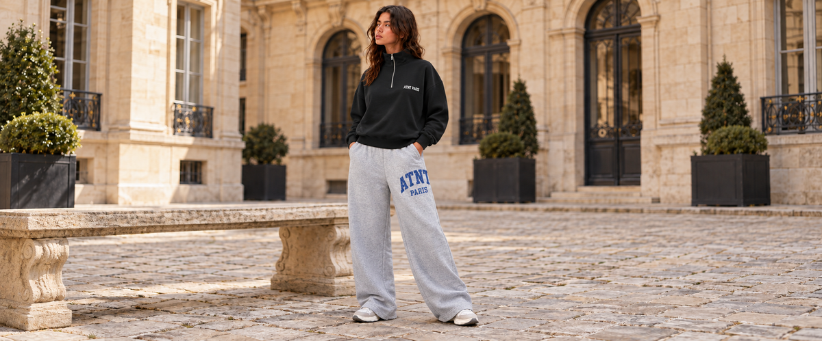 Sweat Col Trucker Noir – Essentials porté dans une ambiance lifestyle ATNT PARIS