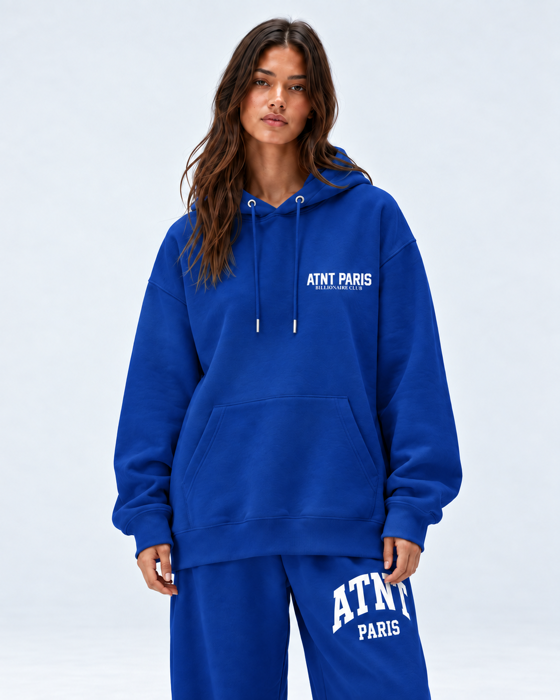Sweat Billionaire Club bleu ATNT PARIS — porte face, studio gris clair