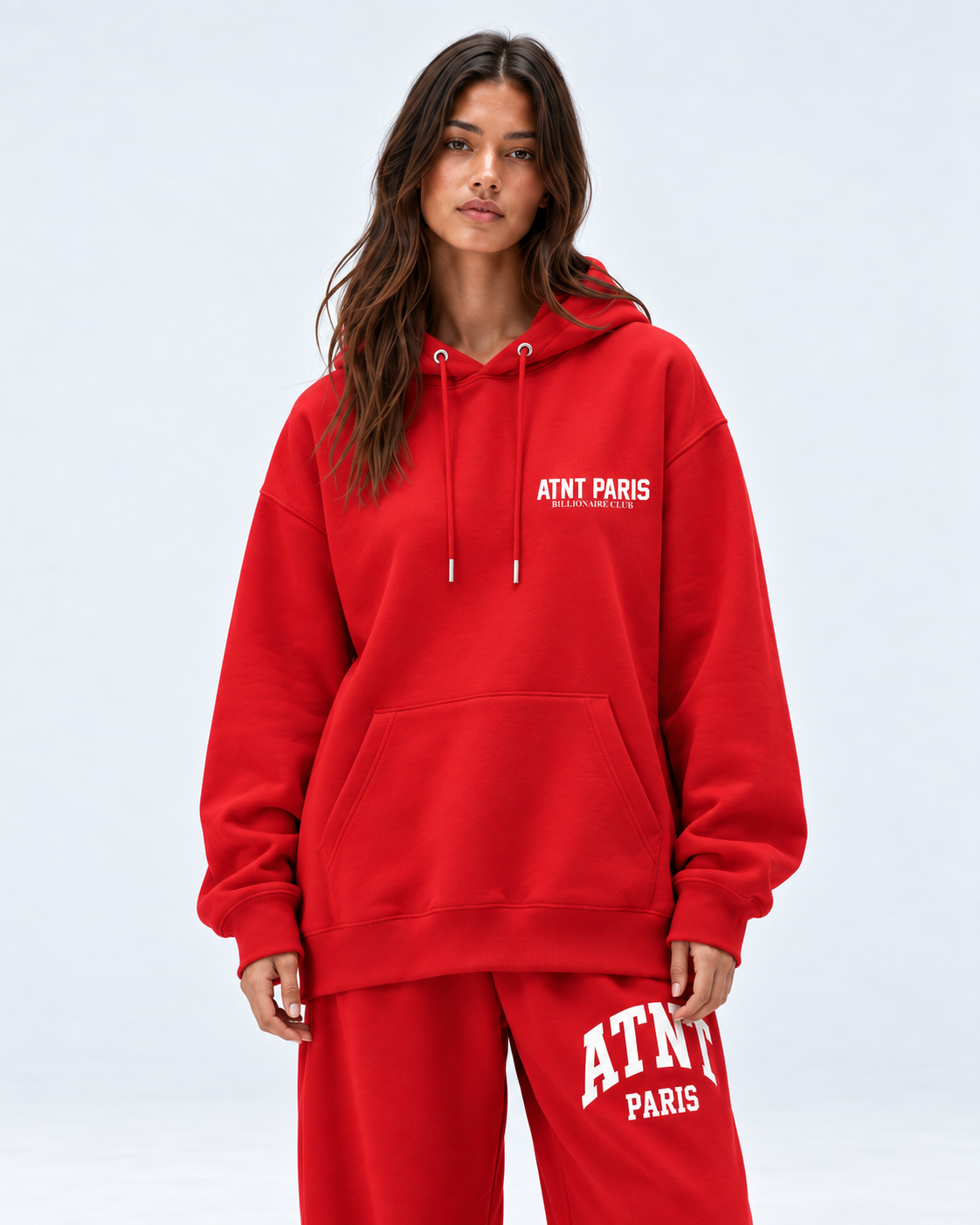 Sweat Billionaire Club rouge ATNT PARIS — porte face, coupe portée ample, studio gris clair
