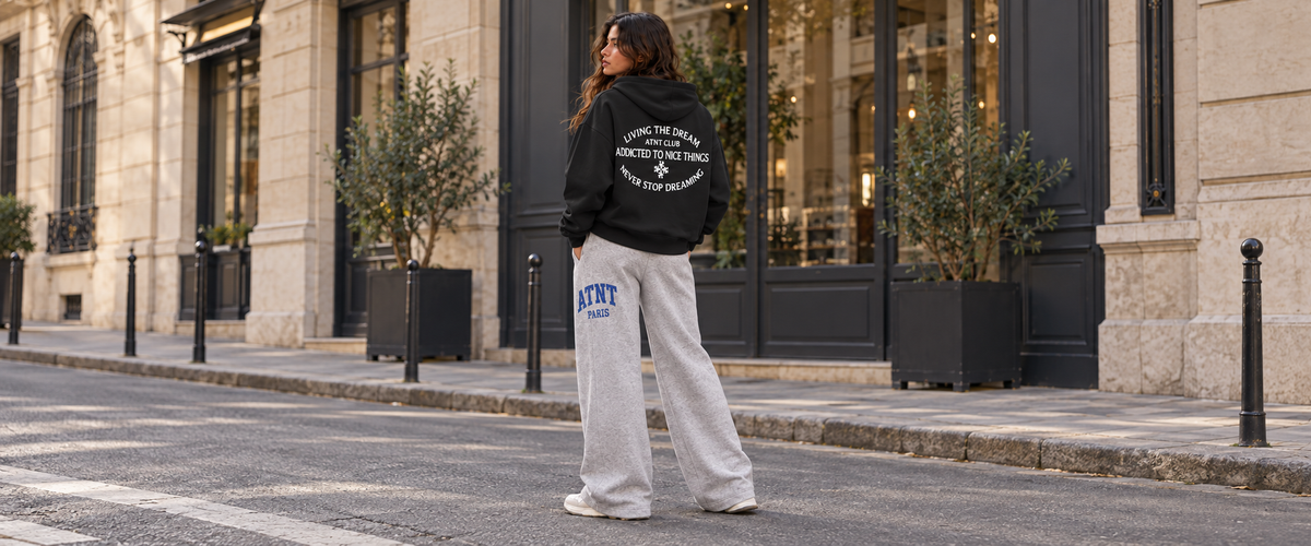 Sweat capuche Noir Never Stop Dreaming porté dans une ambiance lifestyle ATNT PARIS